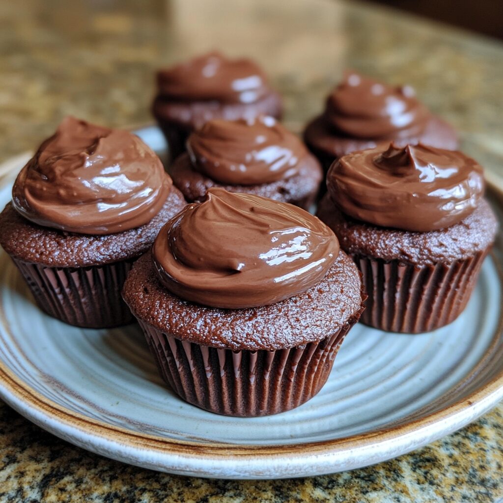 The Best Chocolate Cupcakes presented in natural light with a homemade look